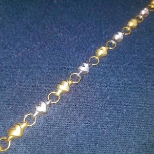 Solid gold and white gold heart bracelet